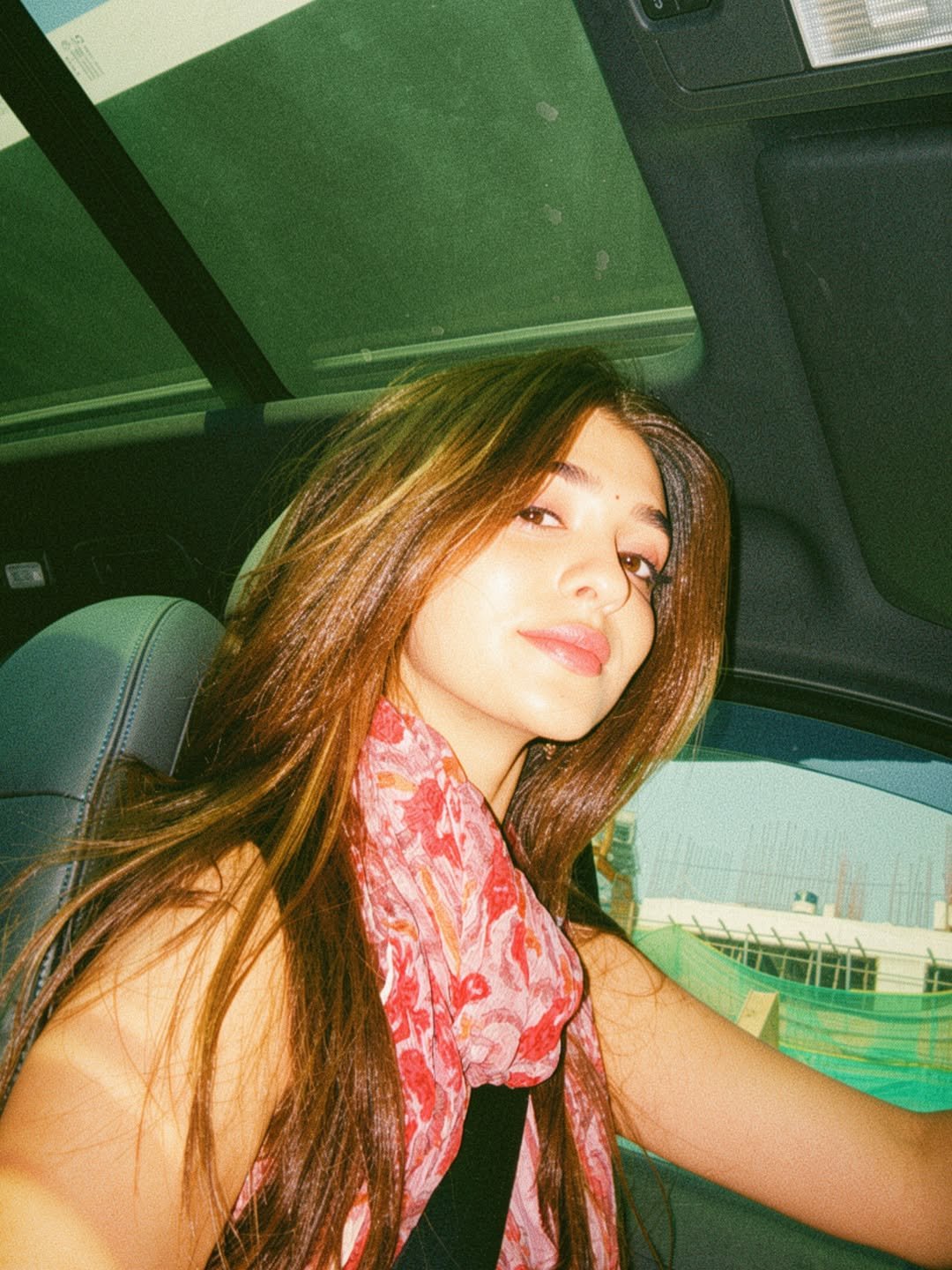 Pranali Rathod Pranali takes a car selfie wearing a floral scarf