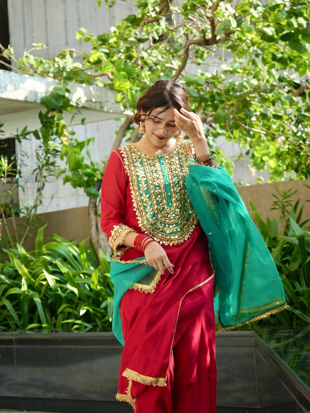 Rj Mahvash Mahvash wears red and green traditional clothing outdoors