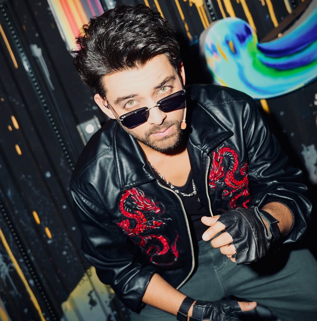 Samarth Jurel poses in a black jacket and sunglasses