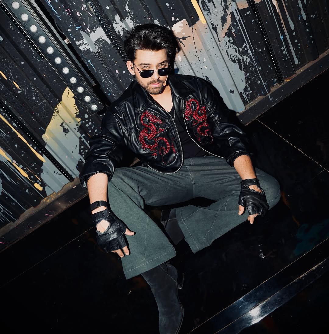Samarth Jurel sits wearing a black jacket and sunglasses