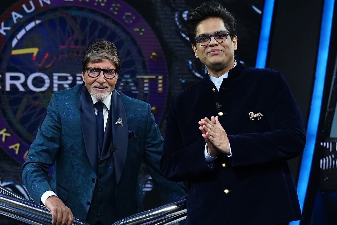Tanmay Bhat poses beside a guest on a television set